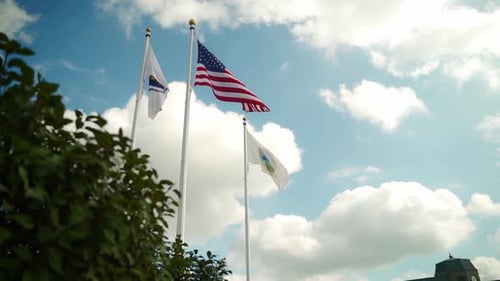 American Flag Waving on Sunny Day with Clouds