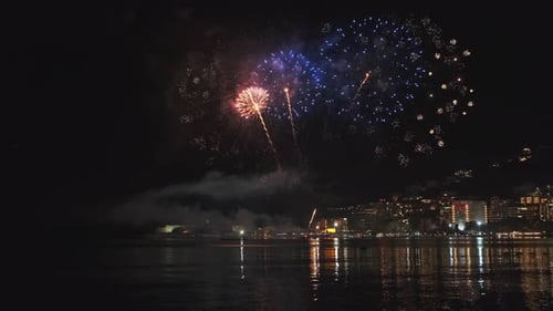 Fireworks with Colorful Lights Over Sea