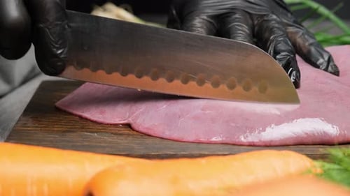 Chef s Hands in Black Gloves Place Fresh Beef or Pork Liver on a Cutting Board and Cut It Into