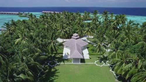 Hotel Among Palm Trees on an Island in the Maldives