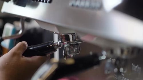 Coffee Being Made with a Silver Espresso Machine