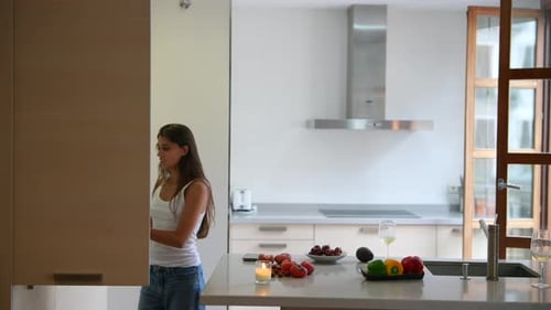 Young Woman in Modern Kitchen Preparing Fresh Fruit