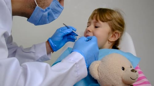Child Patient Having Dental Checkup at Clinic