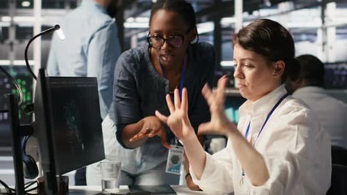 Data Center Technicians Adjusting Blade Server Hardware Powering AI