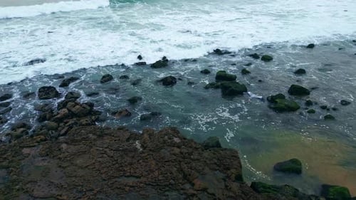 Foaming Surf Covering Rocky Coastline Closeup Sea Waves Splashing Pebble Beach