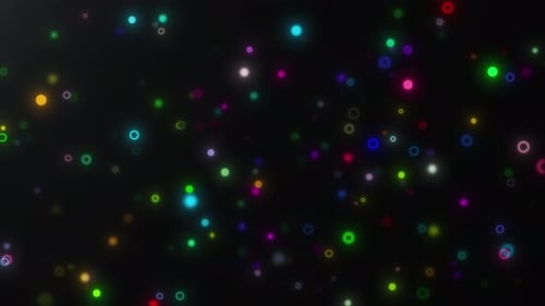 Multi-colored Glowing Particles on Black Background
