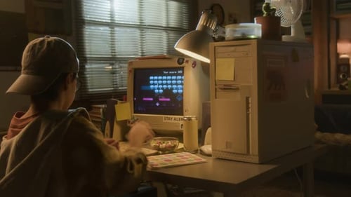 Child Playing Retro Video Game on Computer