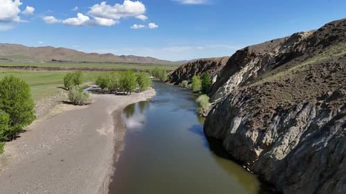 River Flowing Through Rocky Valley