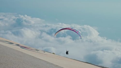 Paraglider Takes Flight on a Sunny Day