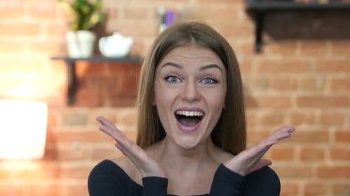 Surprised Woman Gasps and Smiles in Apartment