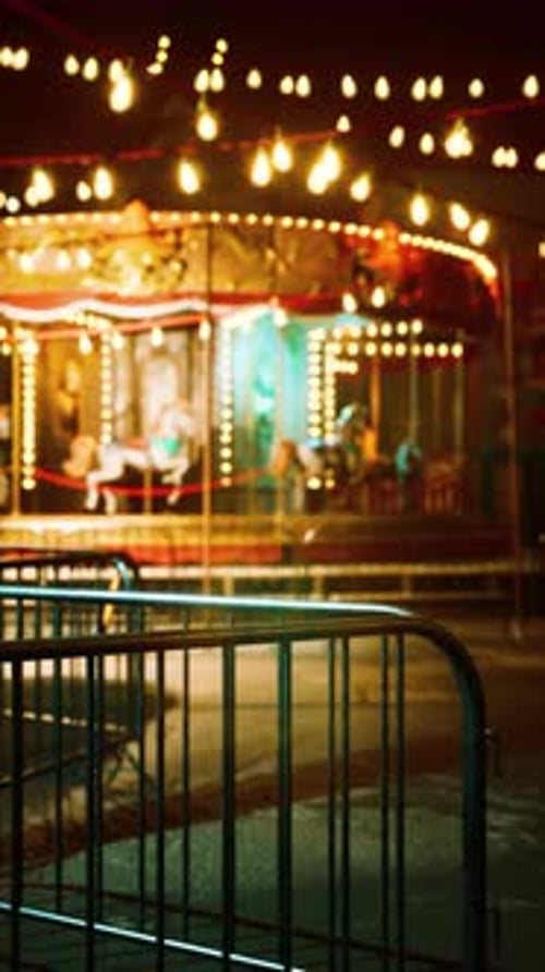 Brightly Lit MerryGoRound in Deserted Amusement Park at Night