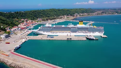 Cruise Ship Docks at Picturesque Coastal Harbor