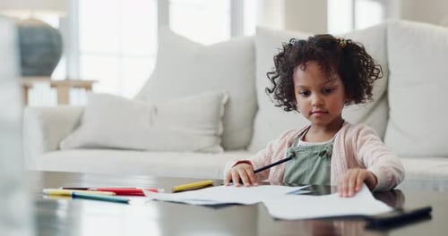 Child Drawing on Paper at Home