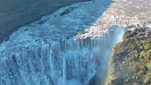 Majestic Dettifoss in Iceland Cascades Powerfully Into Lush Terrain at Sunrise