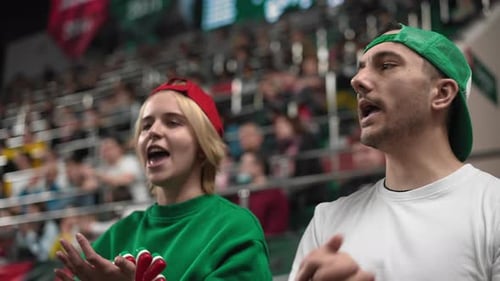 Tense football fans cheer at arena stands. Crowd applaud sporty stadium. Bet win