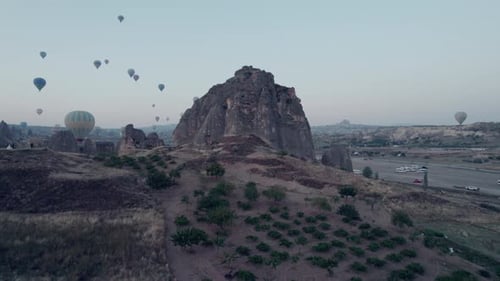 Hot Air Balloons Soaring Over Rock Formations