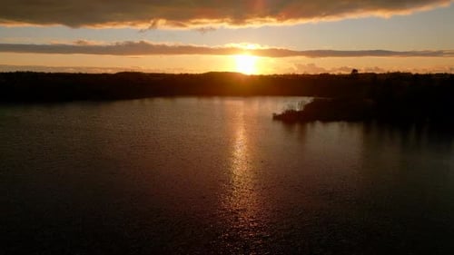 Aerial view of autumn sunset over lake