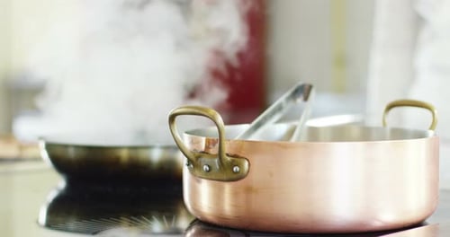slow motion of Italian pasta typical that falls inside a full pot of boiling water to cook the Ita