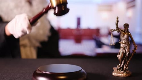 An Intense and Powerful Courtroom Scene Showcases a Traditional Gavel