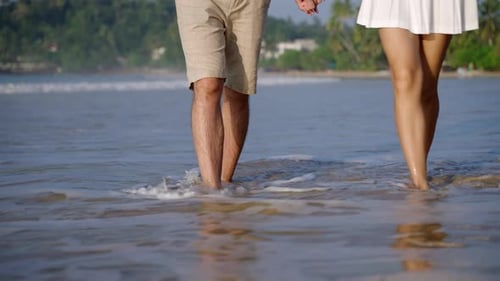 Male Female Feet Walking Barefoot By the Ocean Shore Young Couple in Love Stroll on Wet Sand in Sea