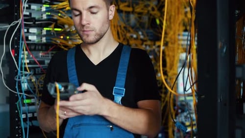 IT Technician Working on Servers in Data Center