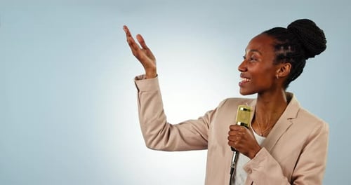 Microphone, information and a black woman reporter on a blue background in studio for a broadcast