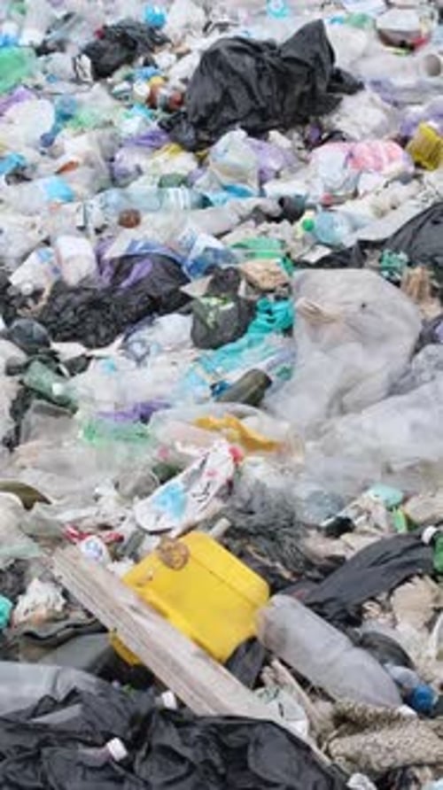 Plastic Waste Environmental Pollution Contaminated Ocean Beaches with Plastic Vertical Video