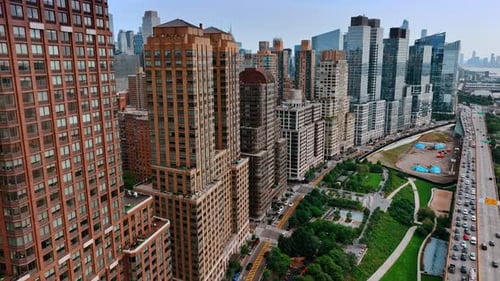 Closer look on the beautiful New York buildings standing near the waters of Hudson.