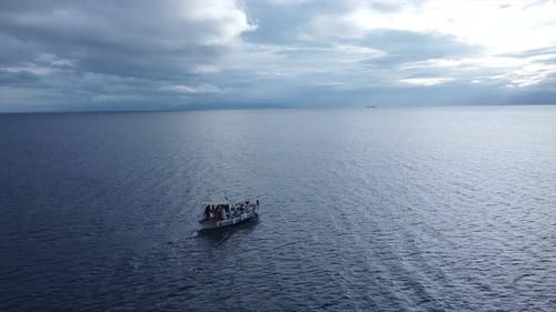 Aerial footage with a greek fish boat alone in the sea
