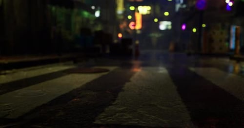 Cinematic Wet Night Street with Blurred City Lights
