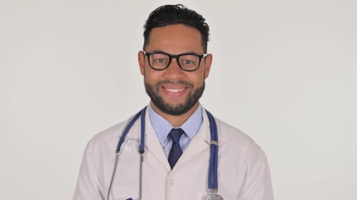 Smiling Doctor with Stethoscope in White Coat