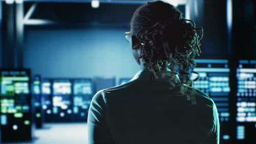 Woman Coding in Data Center