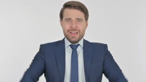 Man in Suit Yelling in Frustration