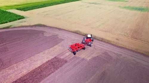Agricultural Machinery Working on Field. Agricultural Tractor on Farming Field. Sky View