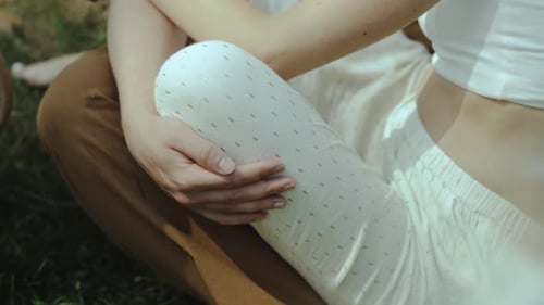 Affectionate Couple Embrace Outdoors on a Sunny Day