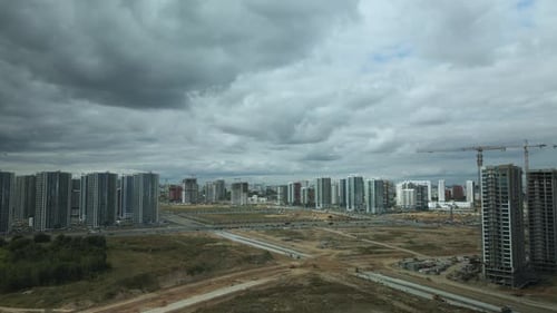 Construction site of a new city block. Construction of multi-storey buildings. Panoramic photo. Aeri