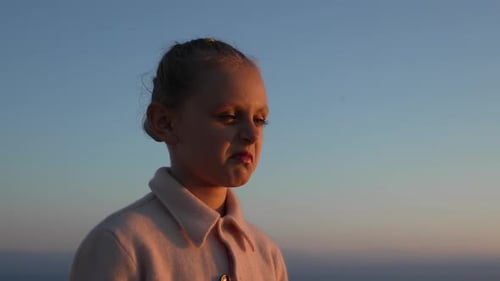 Happy Young Girl Smiling at the Sunset