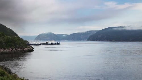 Ferry Boats Sailing in Mountain-Enclosed Bay