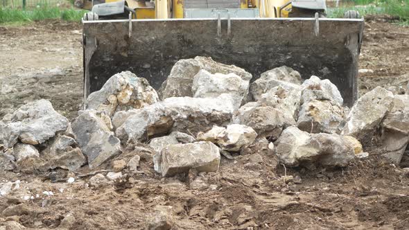 Bulldozer Rocks Construction a Loader Bucket Pushes Concrete Debris ...