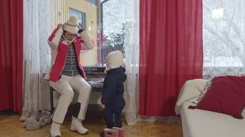 Woman and Child Getting Ready for Winter Outdoors