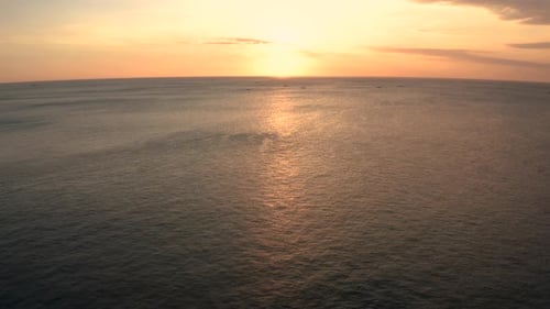 Amazing Dreamland Beach sunset in Bali Indonesia. Golden hour sunset in Bali with amazing blue ocean