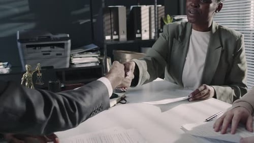 Business People Shaking Hands in Office Meeting