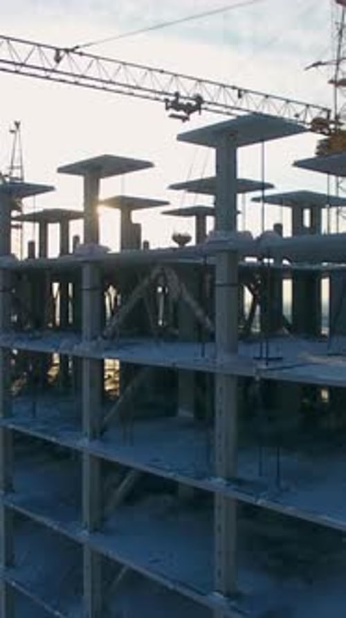 Construction Progress of a Highrise Building in an Urban Area Showing Structural Framework and