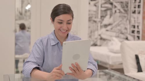Young Woman Video Calling with Tablet at Home