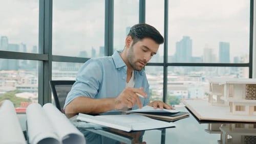 Architect Designs Building Model in Modern Office Setting