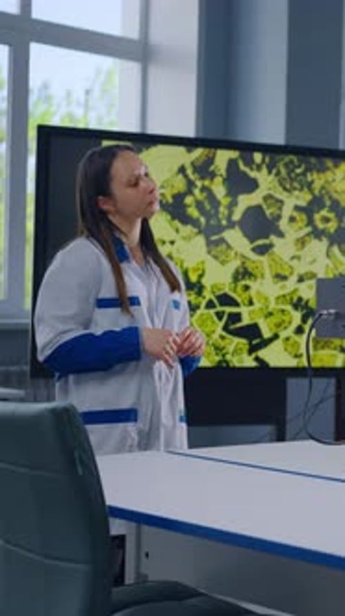 Female Doctor Explaining Medical Research in Bright Lab