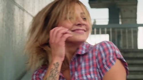 Young Blonde Woman Shaking Head and Hair Having Fun