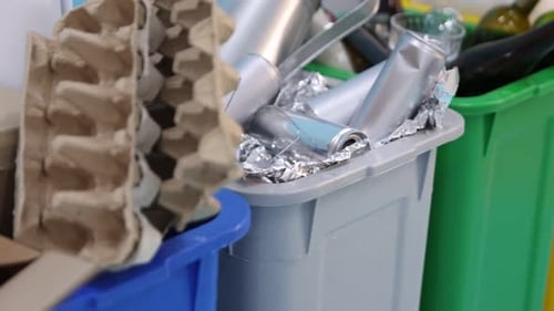 Colorful Bins of Cardboard, Metal, Glass Recycling