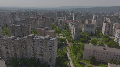Aerial view of old Soviet era housing buildings architectural style and residential blocks with cars