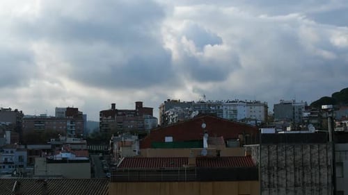 Timelapse of clouds moving in the city in the afternooon.